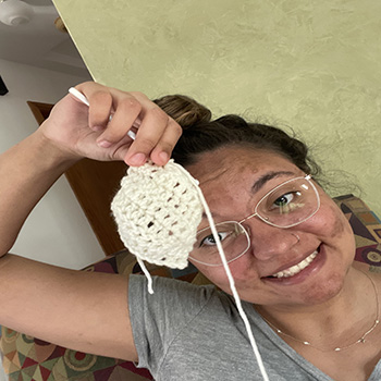 Me crocheting my first project!